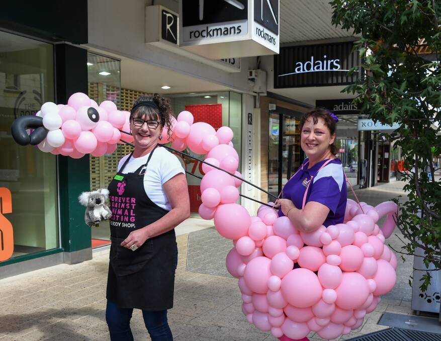 COLOURFUL CHARACTER: Blast Balloons and Parties business owner Sharon Parry (right) surprises a worker in the Launceston CBD on Thursday. Picture: Neil Richardson.