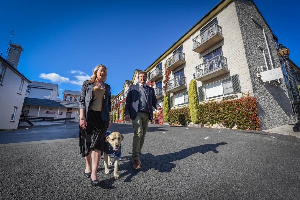 SHARP DOWNTURN: Tenille, Lincoln and Dale Pentland outside the empty Quality Hotel Colonial in Launceston. Picture: Paul Scambler