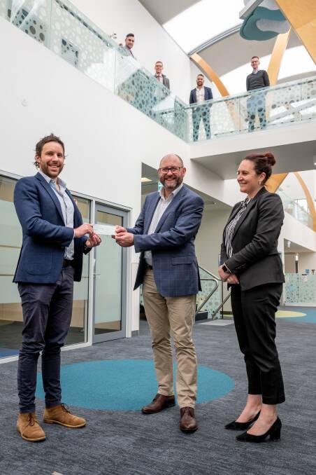 SUPPORTING TALENT: Harrison Humphreys director Tom Harrison and staff member Jessica Bryant hand over a cheque to StGiles chief executive Andrew Billing (centre). Picture: Supplied