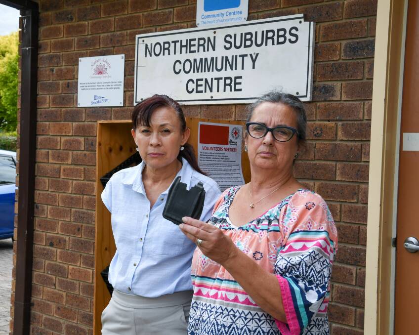 HEARTLESS THEFT: Sai Wan and Denise Delphin at Northern Suburbs Community Centre with remains of the lock box where the stolen car key was kept. Picture: Neil Richardson.