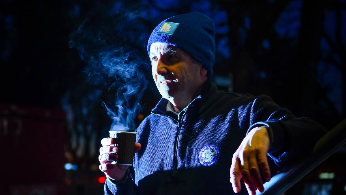 Sleepout: St Vincent de Paul Society state council member Mark Gaetani warms up with a cup of tea. Picture: Scott Gelston