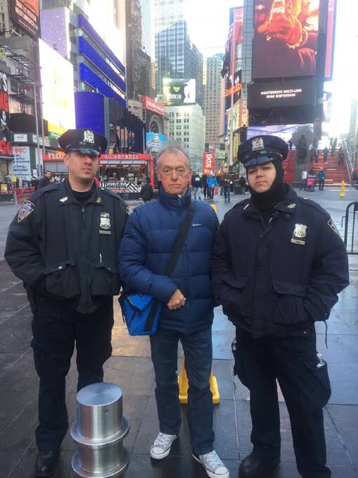 Terror: Eddie Roberts, of Penguin, with two New York Police Officers outside Times Square, after a terror attack took place less than 1km away. Picture: Supplied