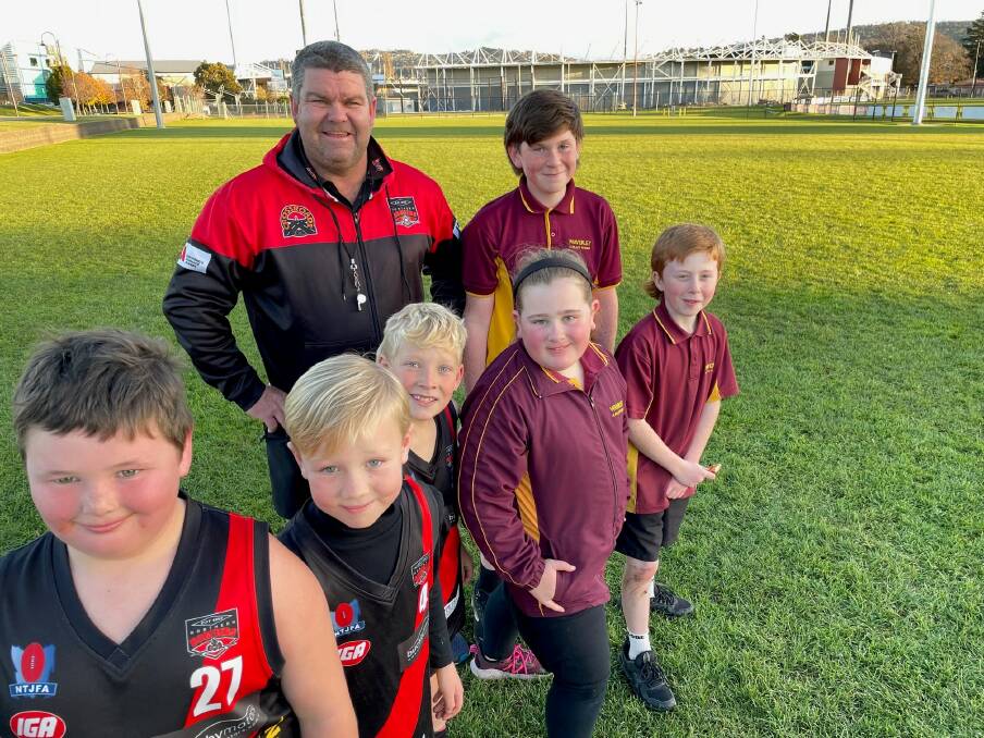 ENJOYING PROGRAM: North Launceston under-9s Coach, Myles Baker with players from his team and Waverley Primary students. Picture: Supplied