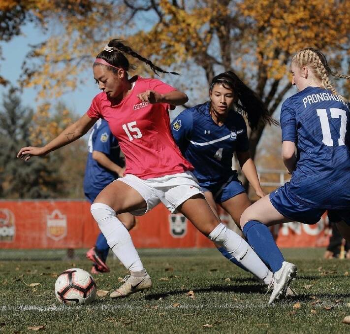 WEAVING THROUGH OPPOSITION: Launceston United signing Montana Leonard, 23, navigates heavy traffic. She'll be one to watch in this season's Women's Super League which starts in March. Picture: Supplied