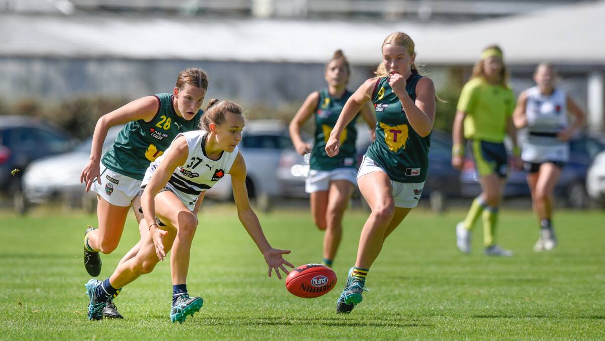 FROM APPLE ISLE: Northern Knights' Rylie Wilcox with Tassie Devils' Candice Belbin and Claire Ransom (9) in hot pursuit last year. Picture: Craig George