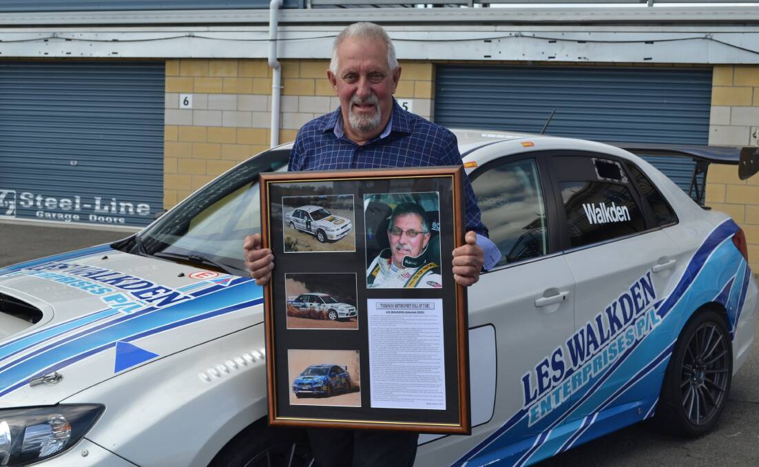 INDUCTED: Les Walkden with the framed memorabilia he received at the ceremony.