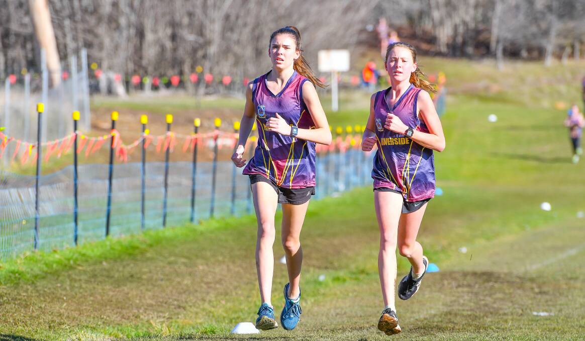 ENDURANCE: Madison Brazendale and Chloe Deans compete for Riverside High in the NHSSA cross-country at Kings Meadows in 2018. Picture: Scott Gelston