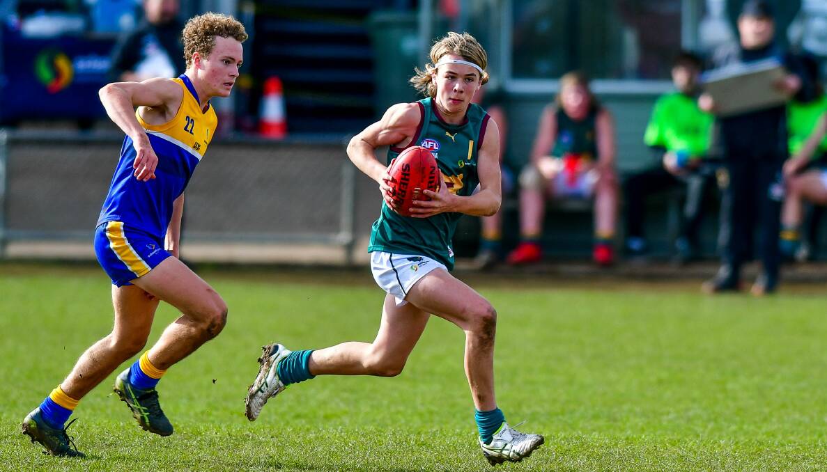 Tasmania's Ryley Sanders breaks out of the middle as Tasmania plays the ACT at Longford during the under-15 AFL national championships in 2019. Picture by Scott Gelston