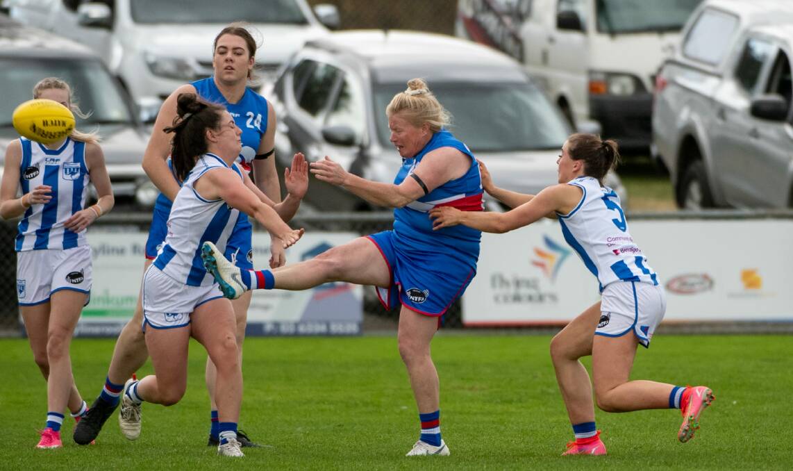 KICKING LONG: South Launceston playing-coach Kate Child in action last season. The Bulldogs face George Town at home on Saturday. Picture: Paul Scambler 