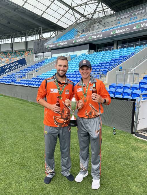 WITH THE TROPHY: Greater Northern Raiders teammates Jono Chapman and Evan Gulbis after their team's Twenty20 grand final win. 