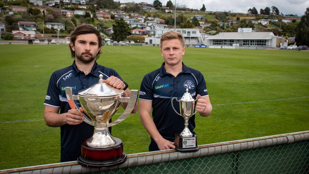 Launceston midfielder Brodie Palfreyman and development league skipper Liam Canny with the premiership cups ahead of their TSL grand finals. Picture by Paul Scambler