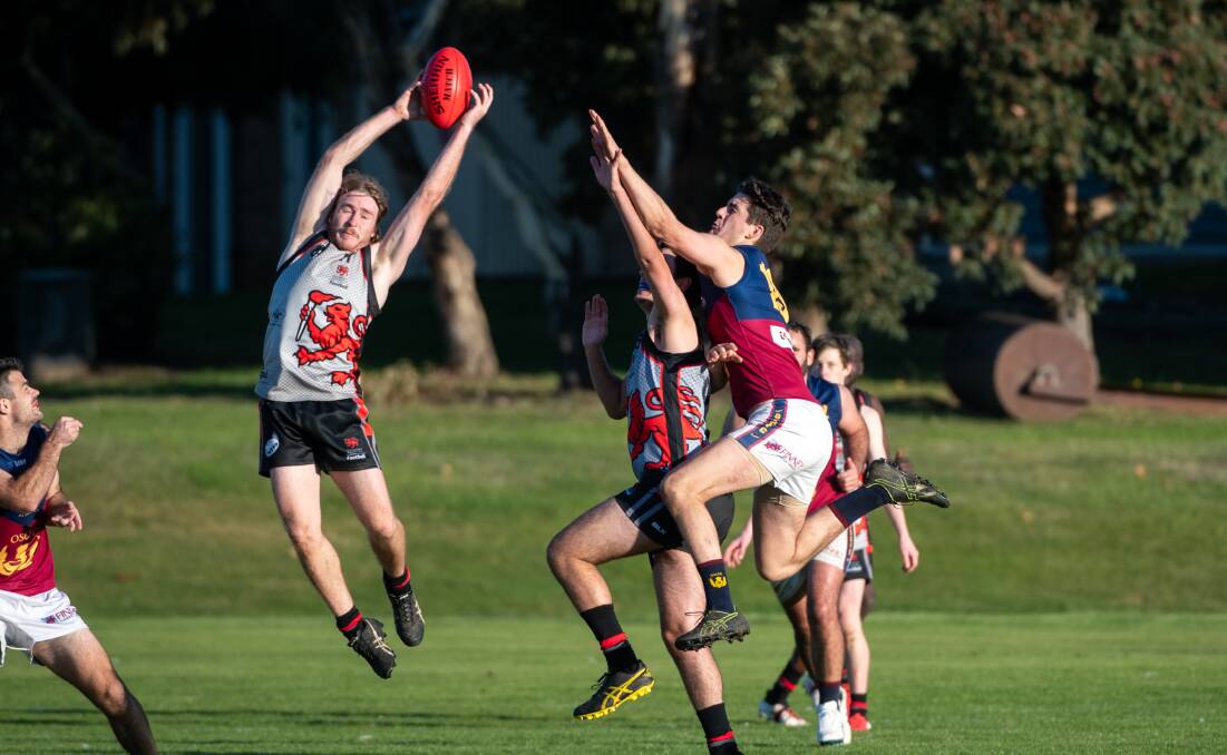 LEAP: UTAS' Ben Hillen flies for the ball during his team's match against Old Scotch earlier this year. 