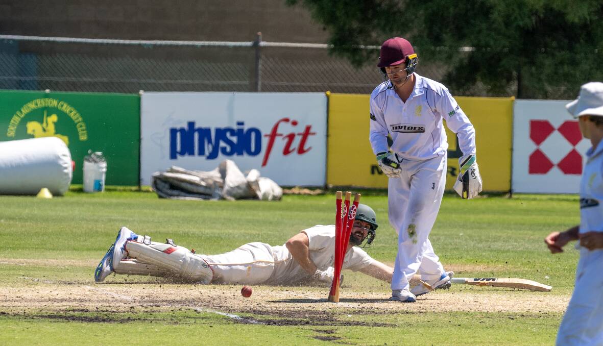 South Launceston batter Nathan Philip survives a run-out attempt from Mowbray wicket-keeper Spencer Hayes. 