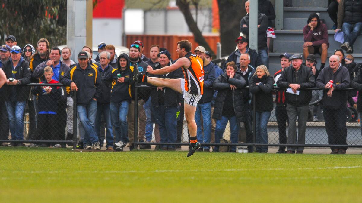 BACK IN: East Coast's Nick Child kicks at goal in 2017 during the season he kicked more than 100 majors. Picture: File