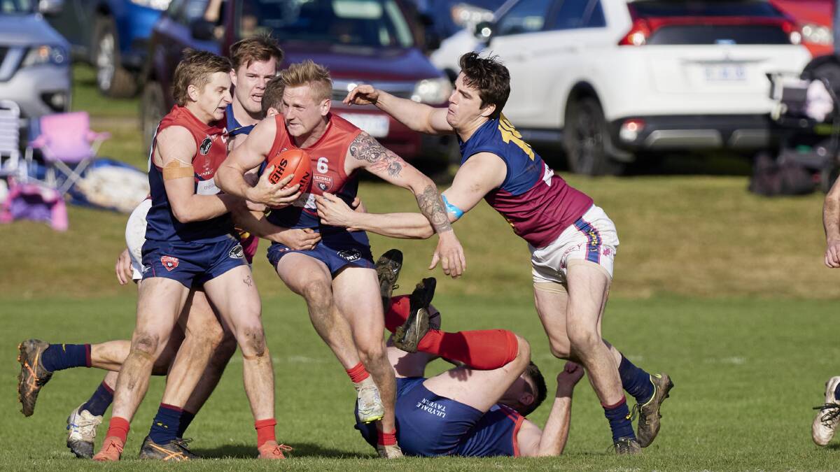 IN THE ACTION: Old Scotch's Jackson Young tackles Lillydale's Reuben Rothwell.