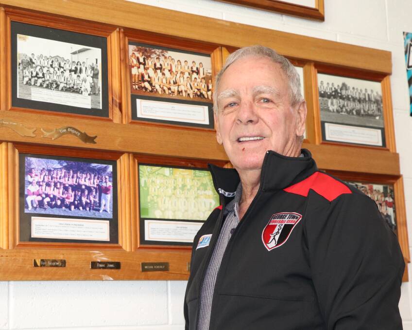 ACHIEVEMENT: George Town's Peter Florrison stands by his team's premiership photo. 
