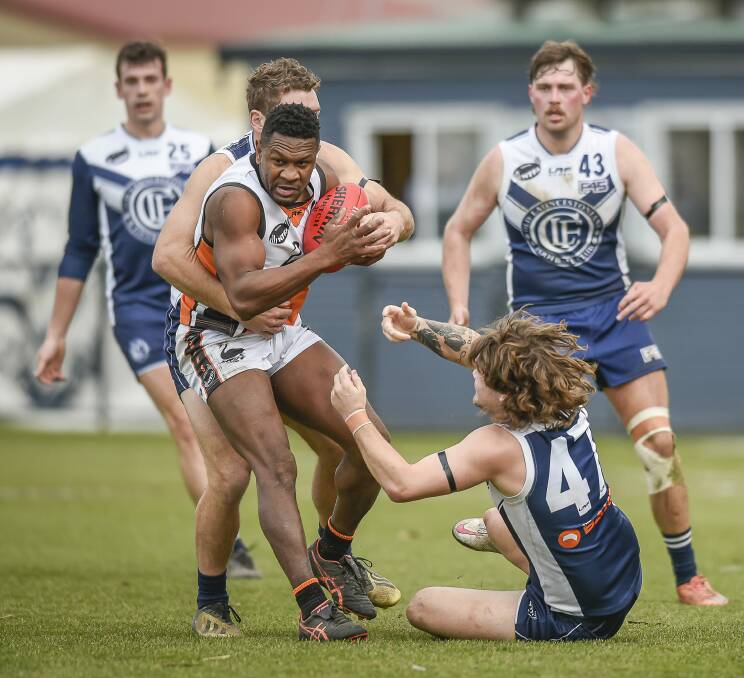 HIGH PRESSURE: East Coast's Toby Omenihu is swamped by Old Launcestonians players in their most recent clash. Picture: Craig George
