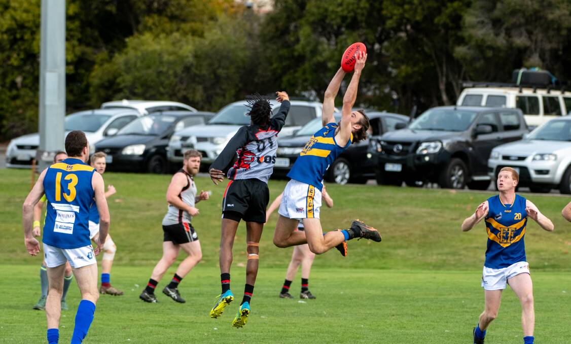 AIR TIME: Evandale's Adam Marland takes a high-flying mark against UTAS at University Oval last weekend. Picture: Paul Scambler