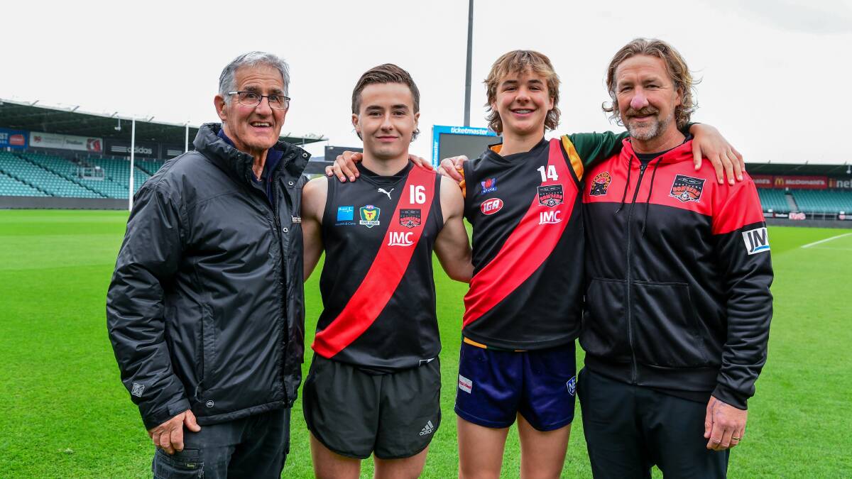 Ryley Sanders with his grandfather Rob, older brother Ollie and dad Adam at UTAS Stadium in 2020. Picture by Neil Richardson 