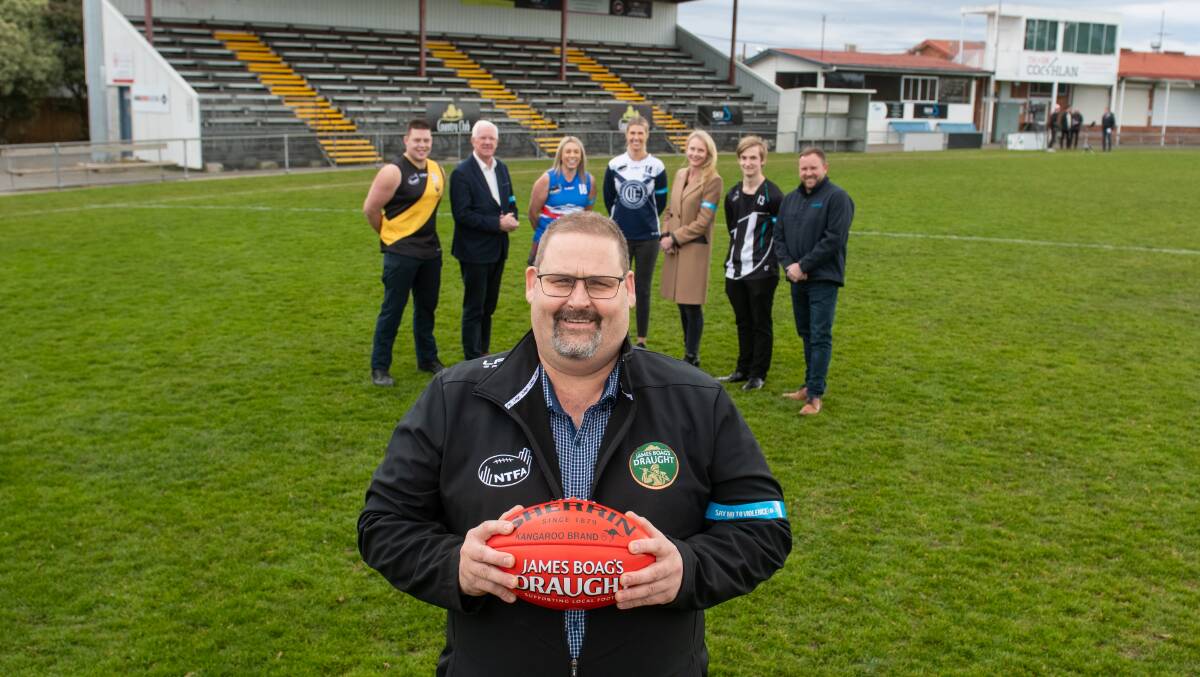 FINALS TIME: NTFA president Scott Rigby (front) with Longford's Luke Murfitt-Cowen, NTFA patron Errol Stewart, South Launceston's Lisa Patterson, Old Launcestonians' Abbey Green, NTFA patron Sarah Courtney, Perth's James Newsum and Cleanaway regional manager Matt Eiszele at Youngtown Oval this week. Picture: Paul Scambler 