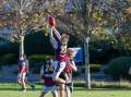 HIGH FLYING: Old Scotch's Jasper Krushka takes a mark over teammate Connor Bryant at University Oval on Saturday. The Thistles defeated UTAS. Pictures: Paul Scambler