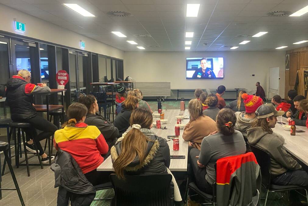 UNIQUE EXPERIENCE: Meander Valley women's team watches a video message from Melbourne AFLW star Libby Birch. Birch is a premiership player and spoke about competing in finals. Picture: Supplied