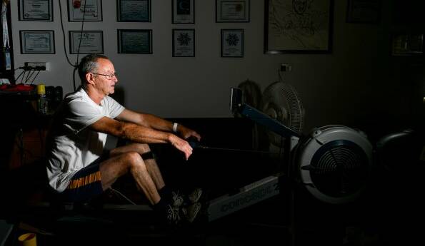 HONOURED: Tamar Rowing Club's Chris Symons with his ergo rowing machine.