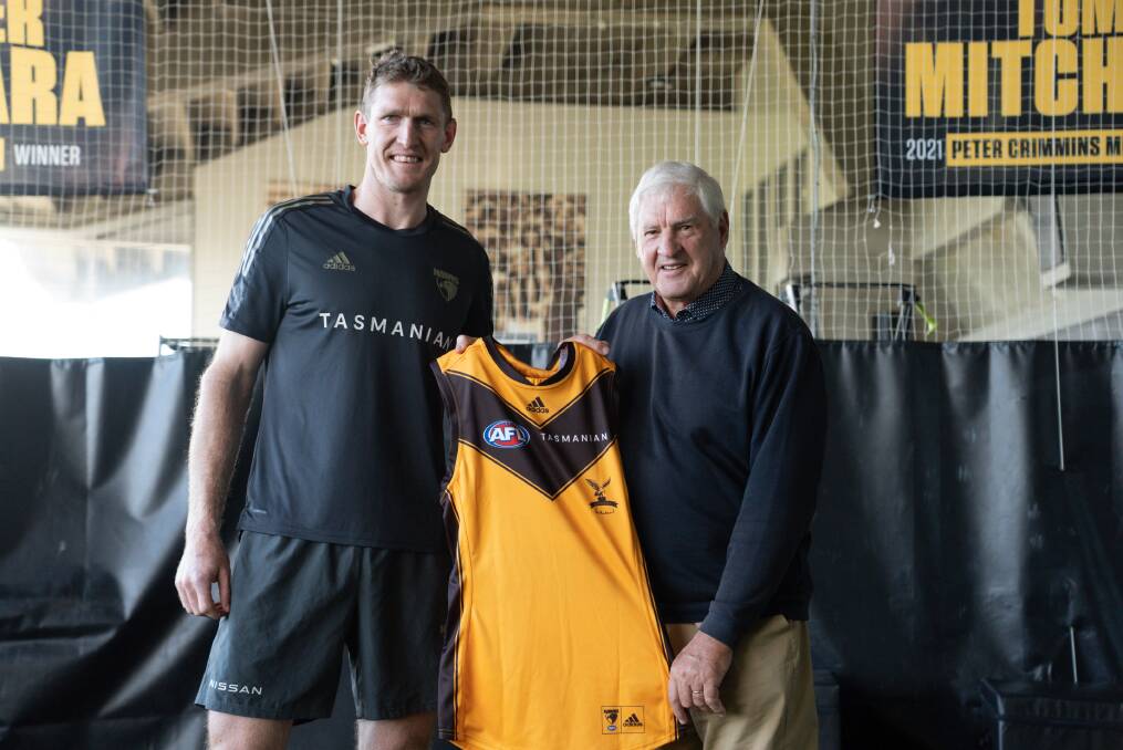 SPECIAL MOMENT: Hawthorn captain Ben McEvoy and Peter Hudson with the Legends guernsey which acknowledges Hudson's contribution to the game. Picture: Hawthorn FC