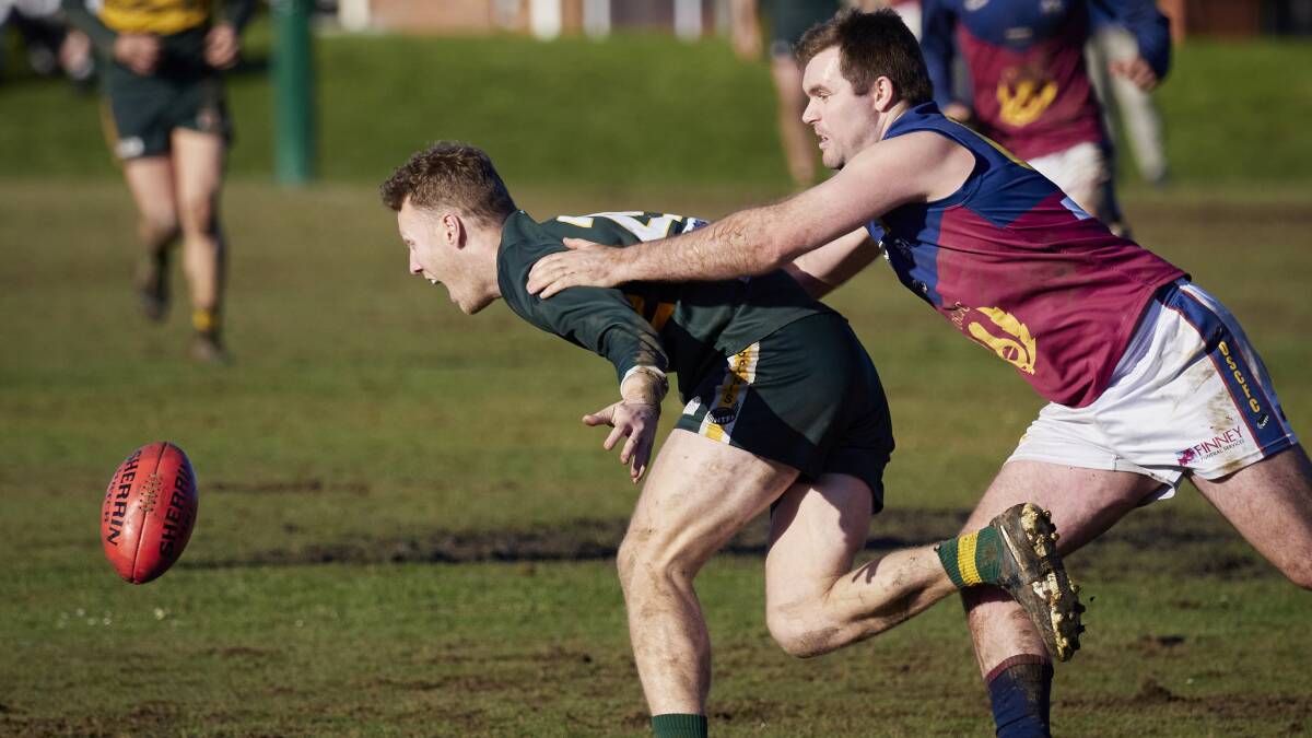 AFTER THE FOOTY: Old Scotch's Angus Scott applies pressure to St Pats captain Tom Hilder.