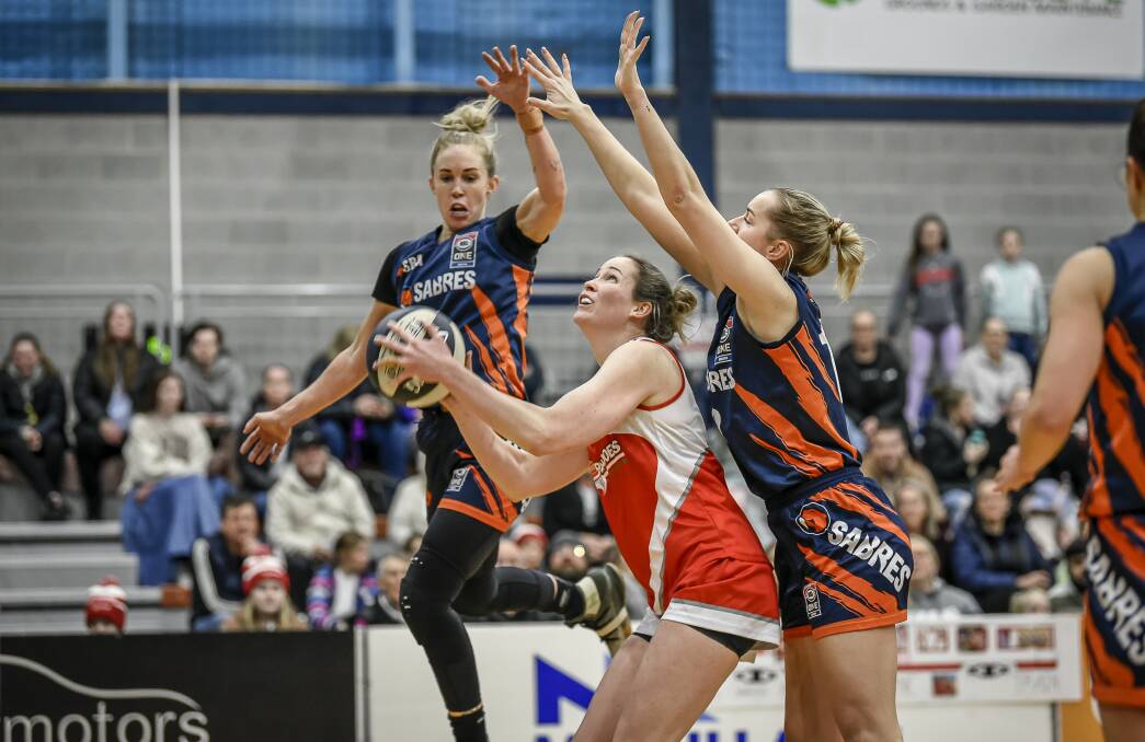 TOUGH NIGHT: Launceston Tornadoes captain Keely Froling shoots while under pressure against Sandringham. Picture: Craig George