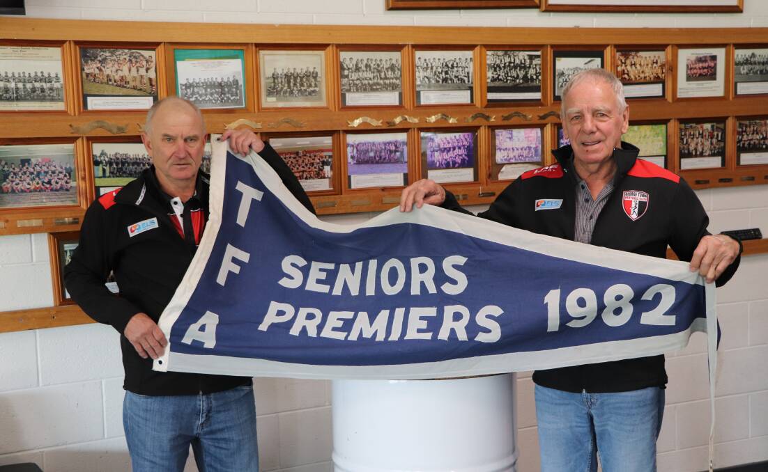 WITH THE PRIZE: George Town 1982 premiership teammates Tim Jones and Peter Florrison.
