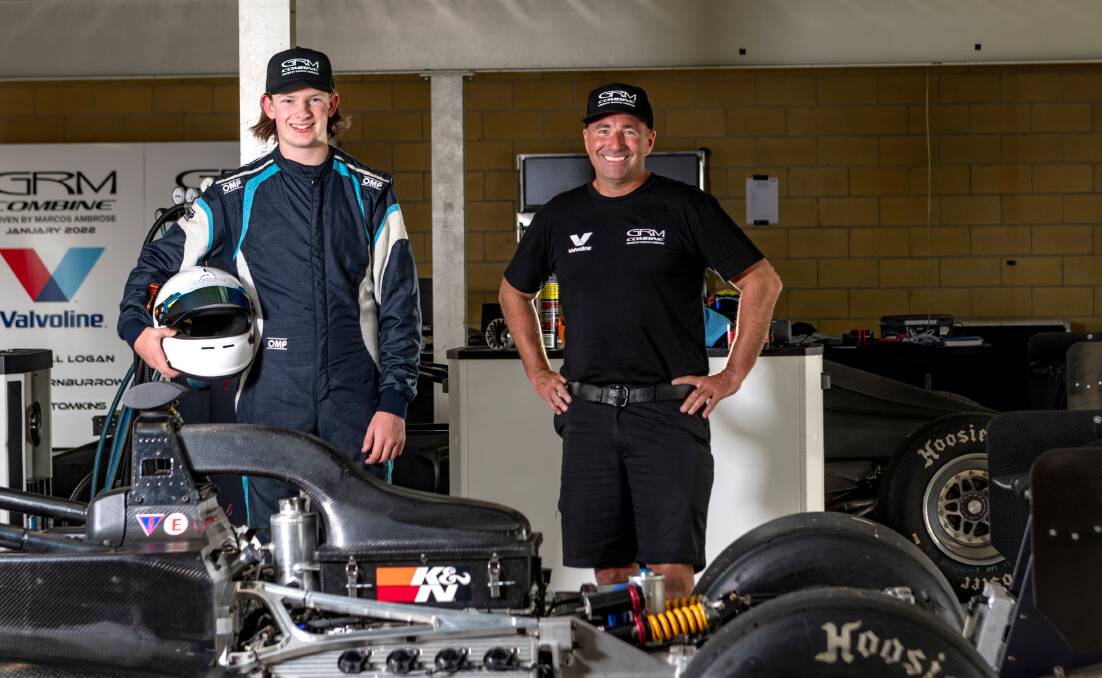 WHAT AN EXPERIENCE: Young Tasmanian driver Campbell Logan and Marcos Ambrose by the S5000. Picture: Phillip Biggs 