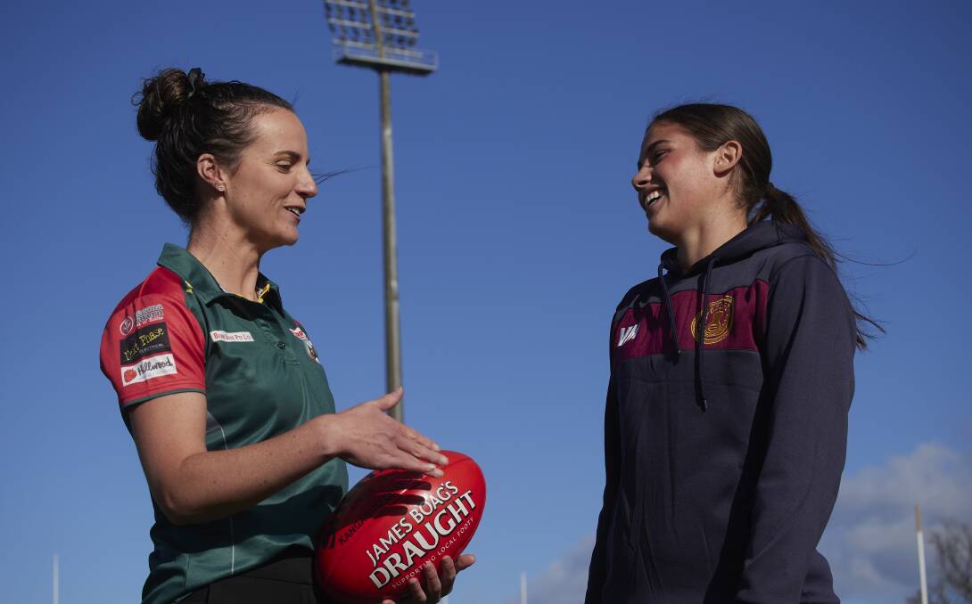 Bridgenorth co-captain Mikaela Clarke and Old Scotch's Maisie Edwards share a laugh ahead of the NTFAW gala day on Saturday. Pictures by Rod Thompson 