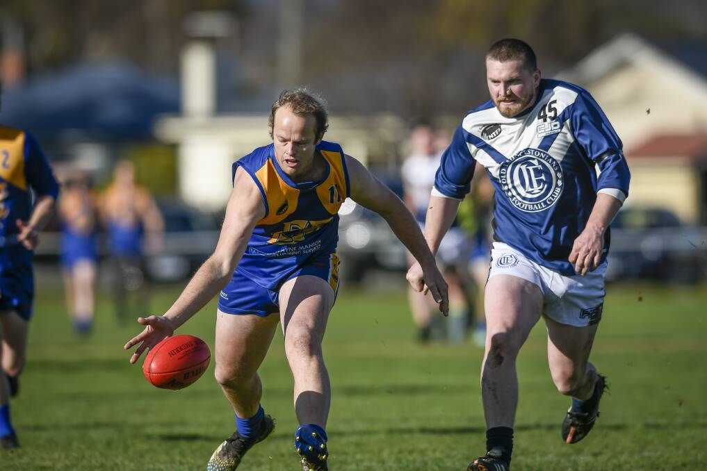 GAME DAY: Evandale's Justin Hutton and Old Launcestonian's Wade Cox chase the ball in 2021. Picture: Craig George
