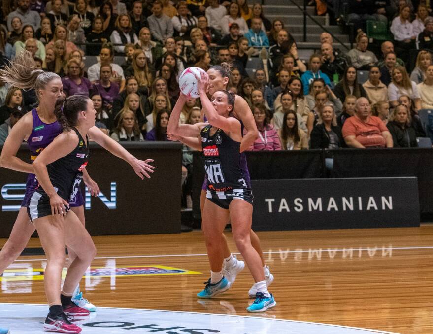 NEXT PASS: Collingwood Magpies' Gabby Sinclair looks for options against the Queensland Firebirds at the Silverdome in 2021. Picture: Paul Scambler