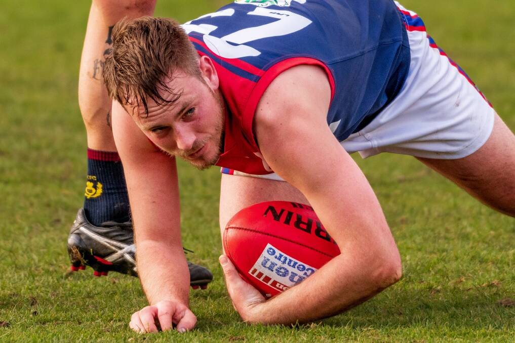 HEAD OVER IT: Lilydale's Shaun Avent during his side's win against Old Scotch. 