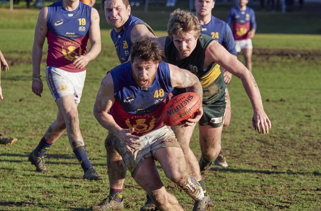 GETTING IN SPACE: Old Scotch's Josh Mathews is chased by St Pats' Patrick Rodman on Saturday at John Cunningham Oval. Pictures: Rod Thompson 