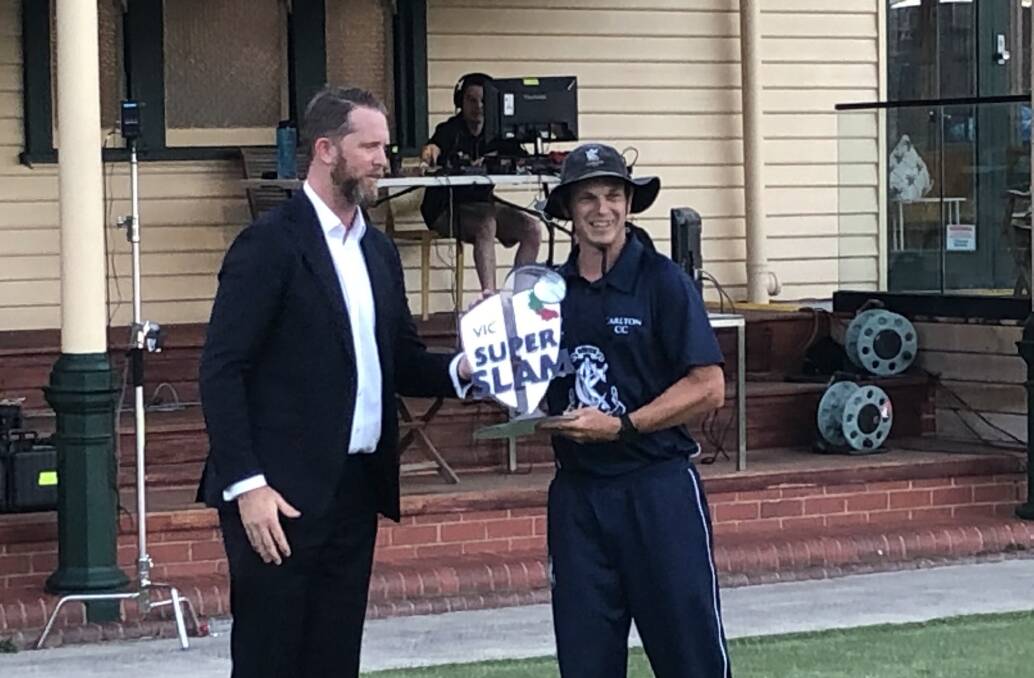 GREAT MOMENT: Cricket Victoria's Liam Murphy presents Carlton captain Evan Gulbis with the VicSuperSlam trophy. 