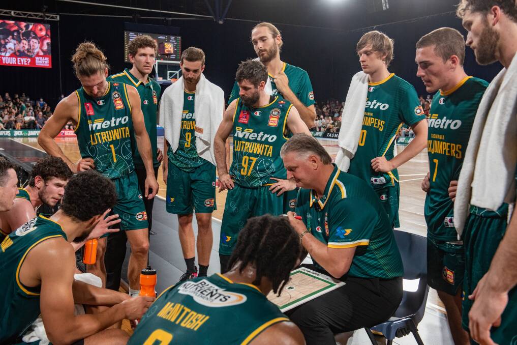 TEAM TALK: Tasmania JackJumpers during a break against New Zealand Breakers at the Silverdome last weekend. Picture: Paul Scambler