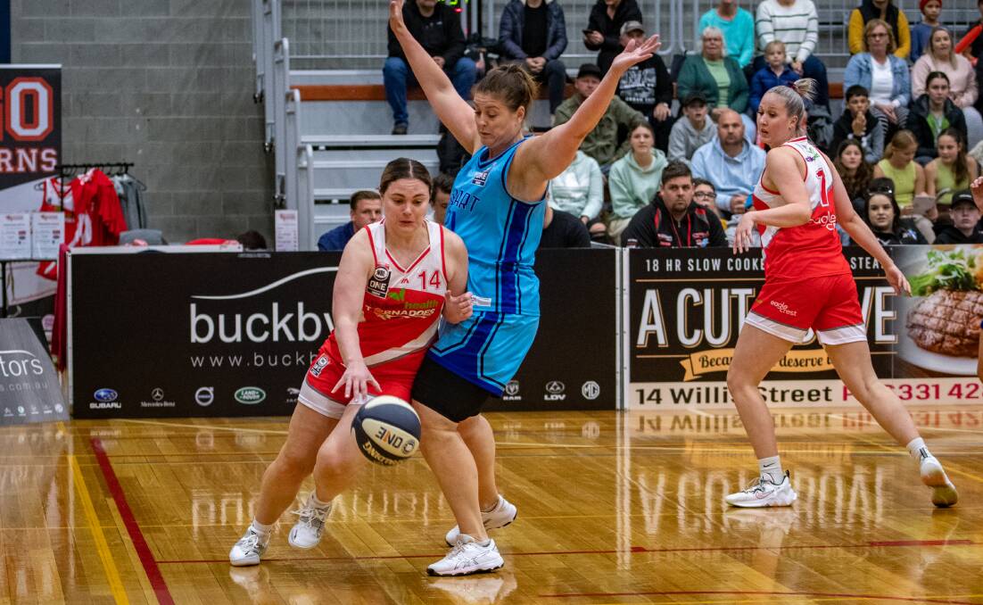 WAITING GAME: Tornadoes' Mariah Payne dribbles past Hobart Chargers' Kylie McCauley earlier this season. Payne had a standout performance last Saturday but is in doubt for this weekend's away matches. Picture: Paul Scambler