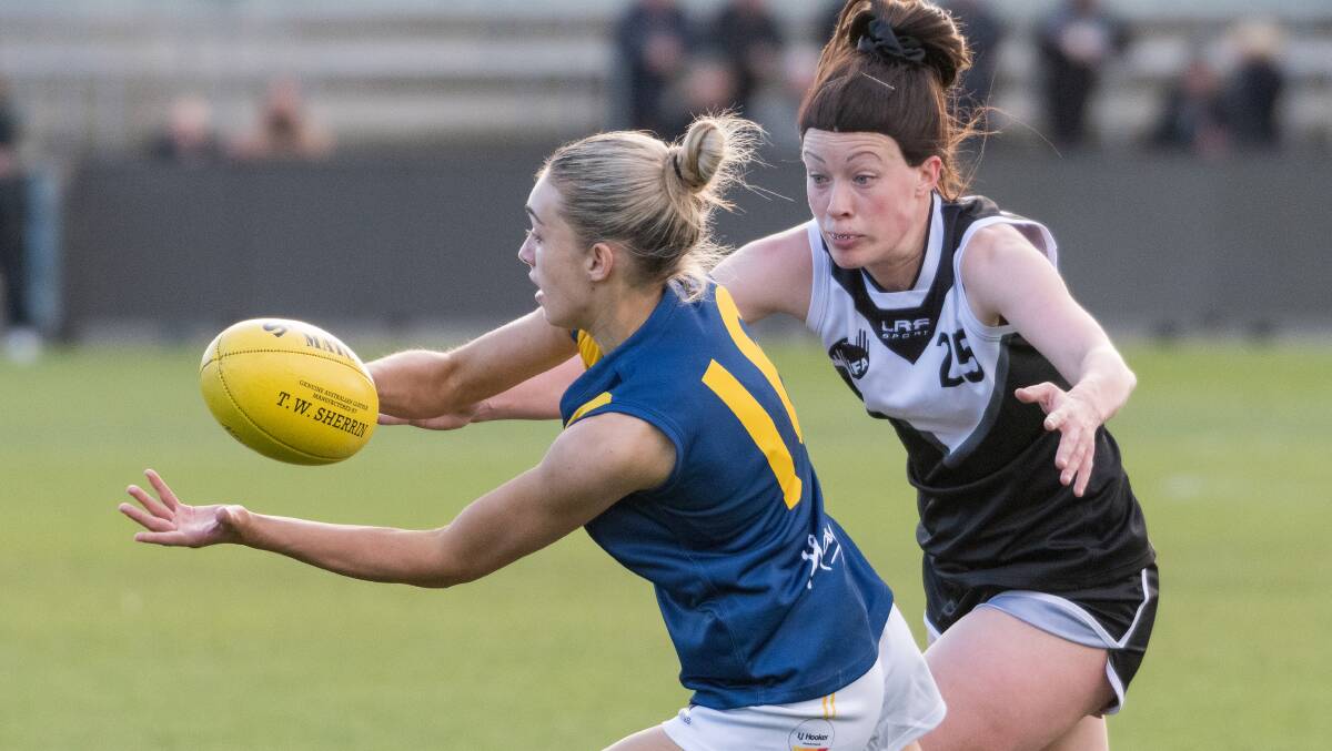 TACKLE: Southern Football League's Elise Barwick (North Hobart) under pressure from Meander Valley's Sophie Townsend. Picture: Phillip Biggs 