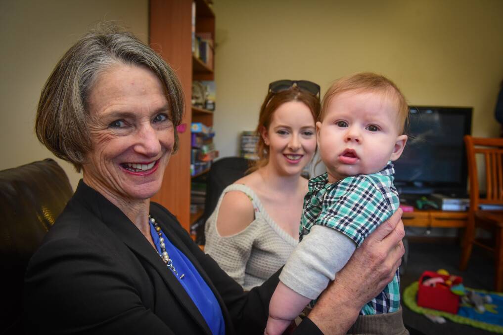 Smiles: Her Excellency Professor the Honourable Kate Warner, AC, Governor of Tasmania, meets Taylor and son Malikaye. Picture: Paul Scambler