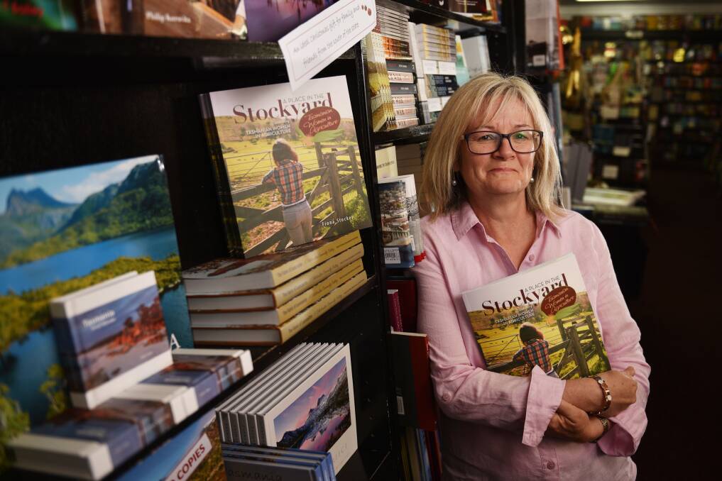 A place in the bookshop: Fiona Stocker at Petrarch's Bookshop with her book 'A Place in the Stockyard' charting the history of women in Tasmania's agricultural industries. Picture: Scott Gelston