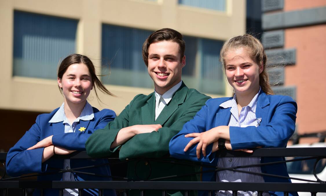To France: Molly Woolcock, 15, Jordan Moss, 15, and Nicole Patrick, 15, won the Frank MacDonald Memorial Prize. Picture: Paul Scambler