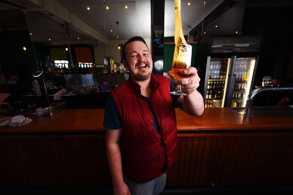 New life: Licencee James Napier toasts the revitalised Greenwood Bar at Lloyds' Hotel, Launceston. Picture: Scott Gelston