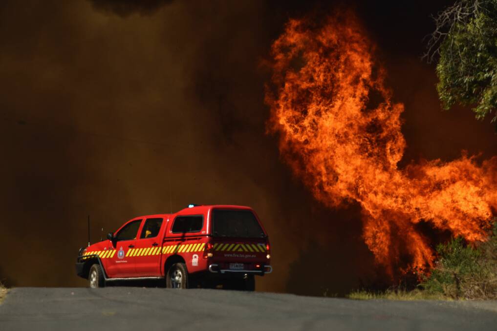 Fire: A Tasmanian Fire Service car at a 2015 bushfire near George Town. Picture: Scott Gelston