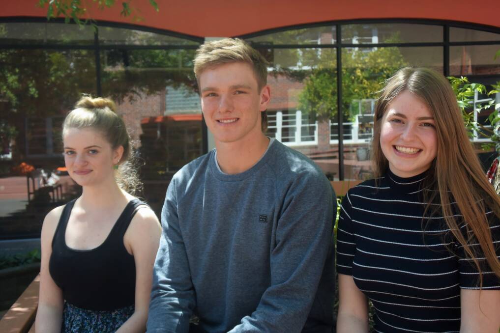 College graduates: Award recipients Emily Britton, Jack Barrett and Sophie Burgess. Picture: Lucy Stone
