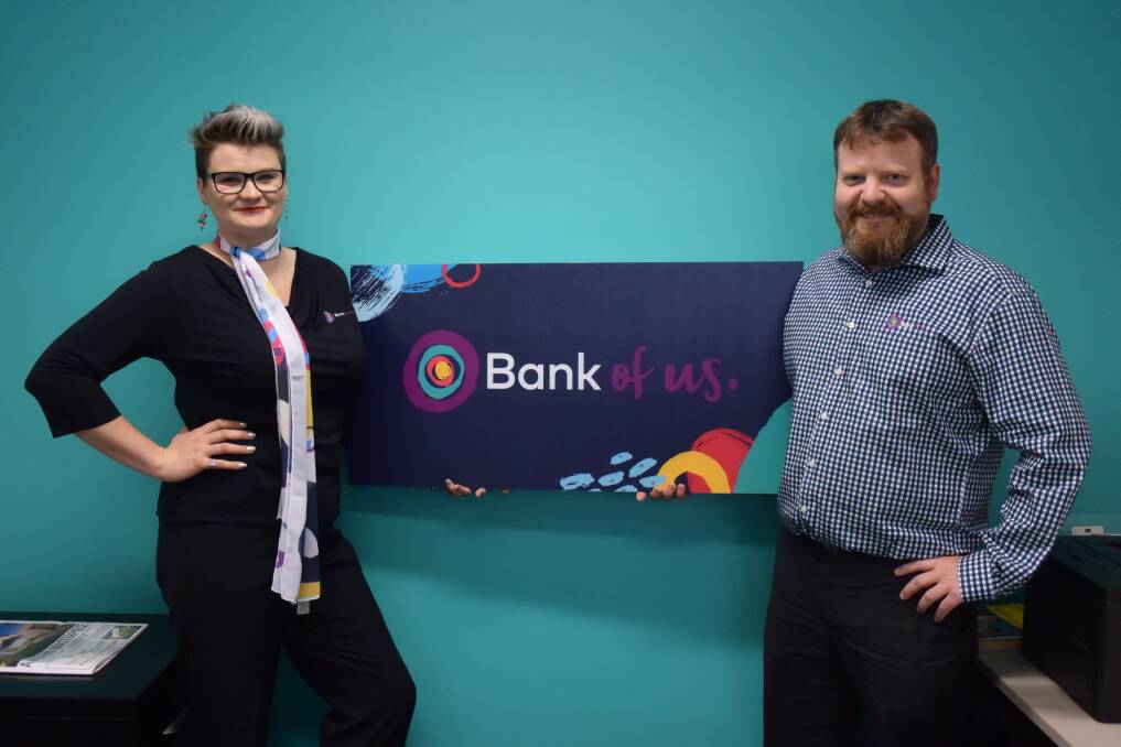 CUSTOMER FIRST: Launceston customer service officer Samantha Hennessy and home finance specialist Matthew Payton trial out the new-look Bank of us logo and uniforms. Picture: Lucy Stone