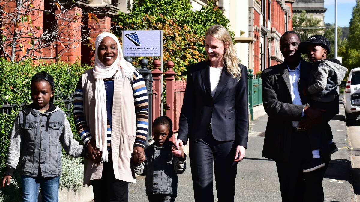 New life: Sarah Courtney MP with Mohamed, 7, Laiela Abdalla, Siddig Ibrahim, and Hamza, 2, and Maher, 4, fron Sudan. Picture: Neil Richardson