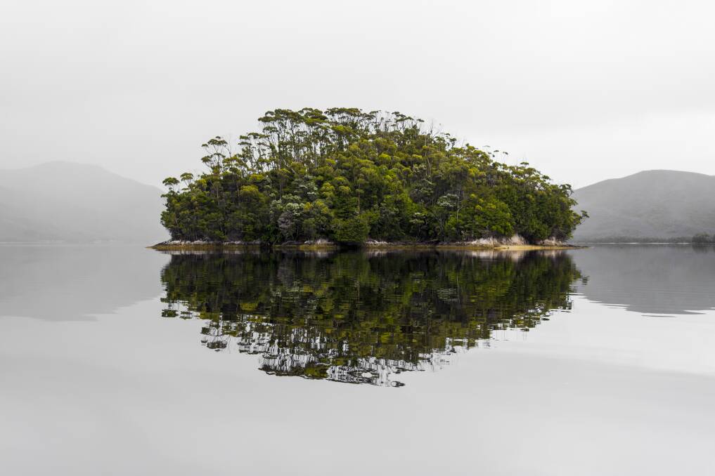 PAUSE: The cover of Paul Fleming's book Pause, about a collection of Tasmanian moments, features one of his favourite places, Bathurst Harbour in the South West National Park. Picture: Paul Fleming.
